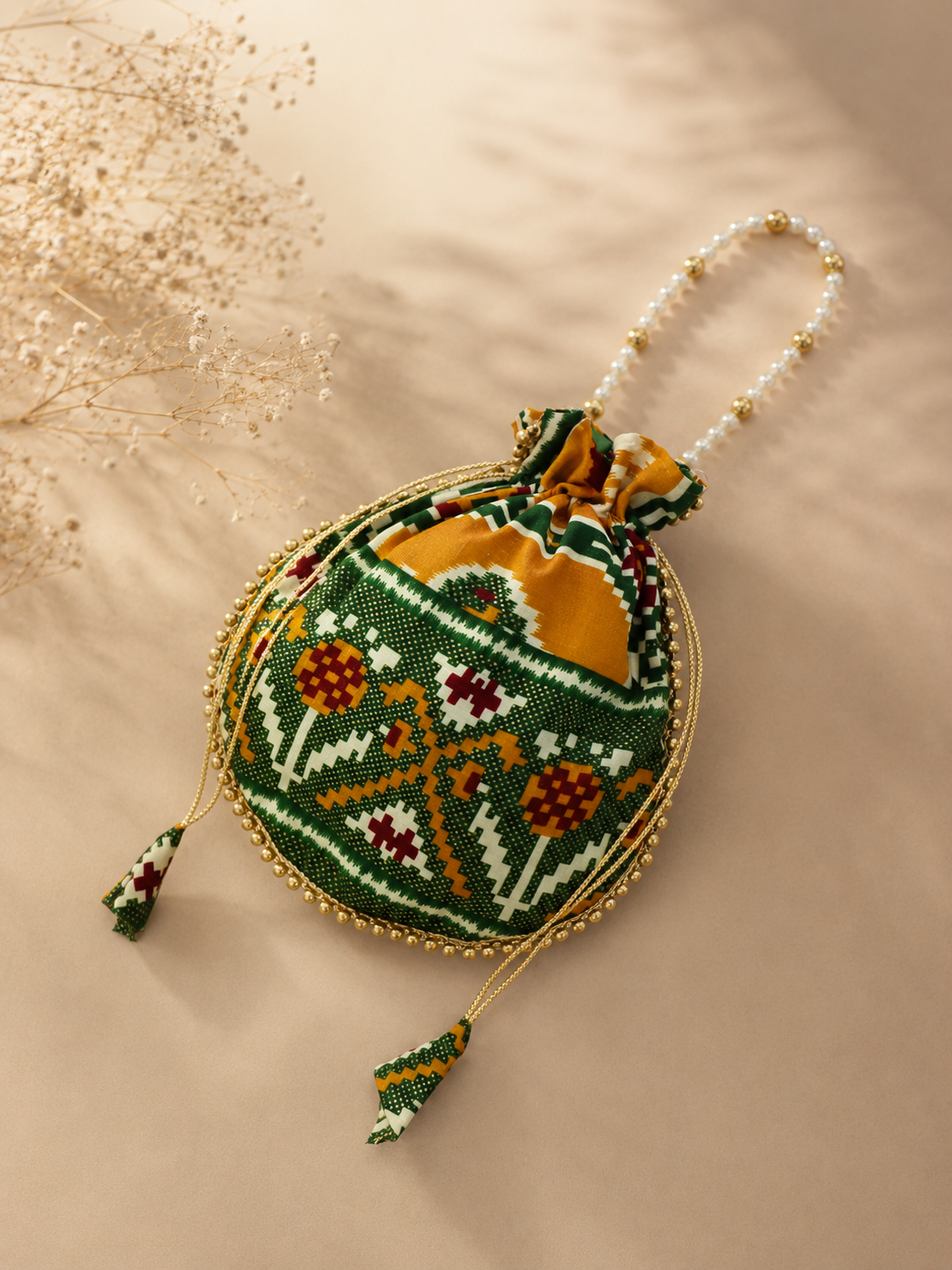 Premium Traditional Ikat Patola Potli Bag – Gold Bead Trim & Beaded Strap