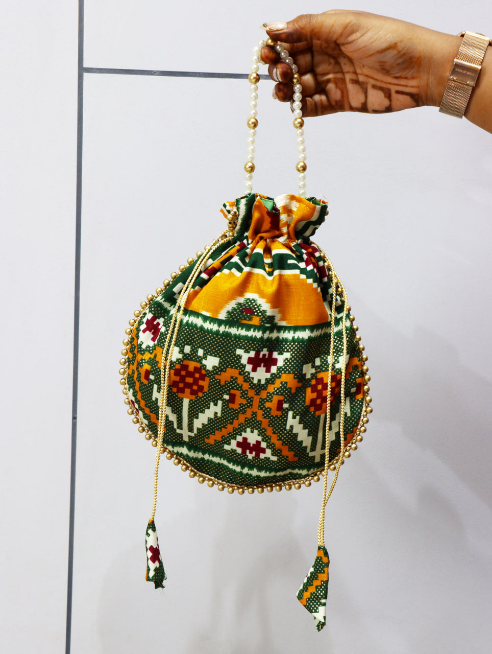 Premium Traditional Ikat Patola Potli Bag – Gold Bead Trim & Beaded Strap