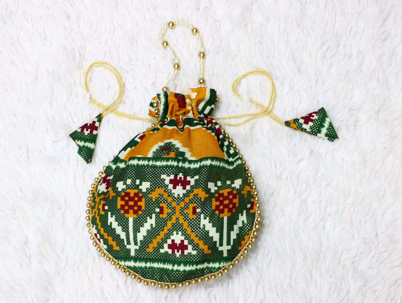 Premium Traditional Ikat Patola Potli Bag – Gold Bead Trim & Beaded Strap