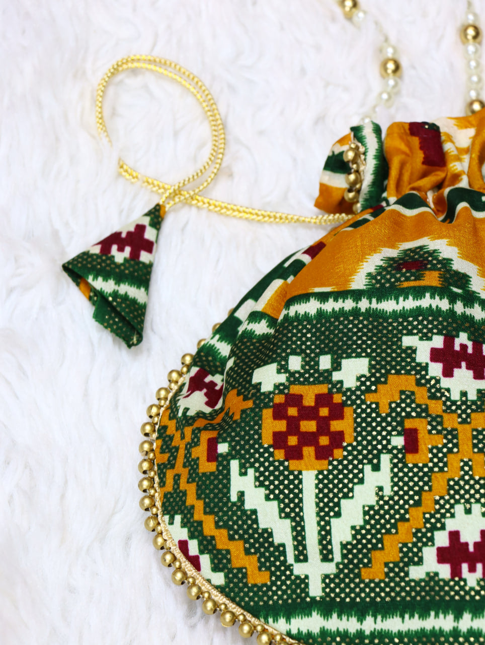 Premium Traditional Ikat Patola Potli Bag – Gold Bead Trim & Beaded Strap