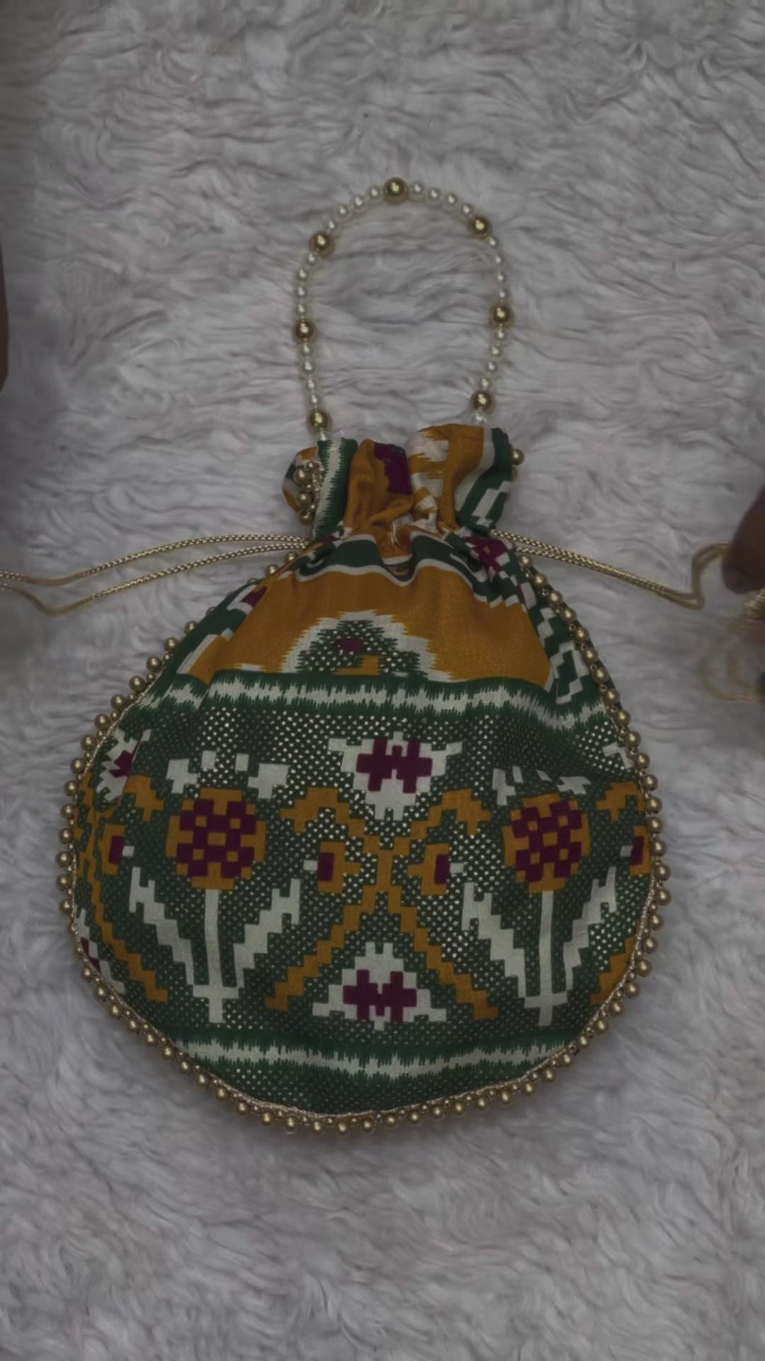 Premium Traditional Ikat Patola Potli Bag – Gold Bead Trim & Beaded Strap